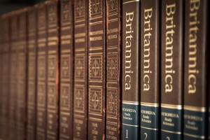 Stock photo of a reference stack at a library featuring different volumes and editions of Encyclopedia Britannica