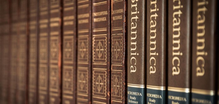 Stock photo of a reference stack at a library featuring different volumes and editions of Encyclopedia Britannica