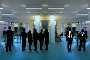 Stock photo of a group of silhouettes in a room