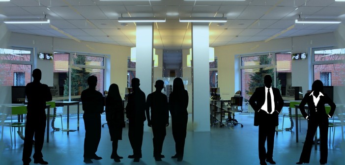 Stock photo of a group of silhouettes in a room