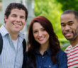 Three smiling youths