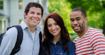 Three smiling youths