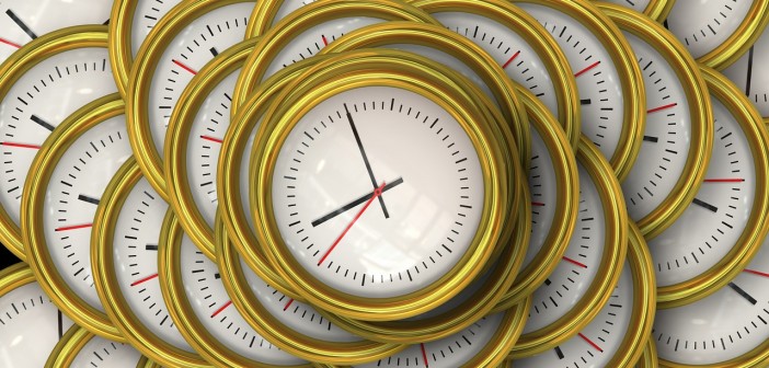 Stock photo of a bunch of white clocks on top of one another. It's 9:00