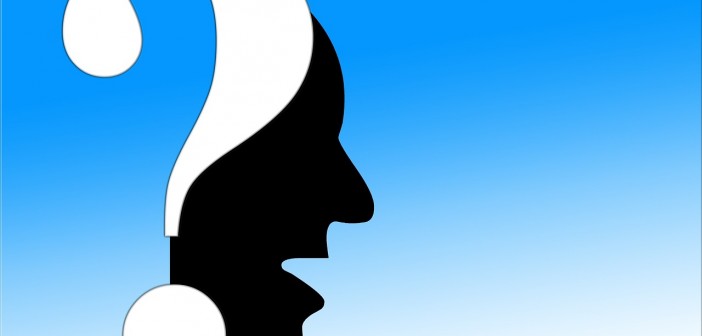 Clip art of a silhouette profile and a question mark