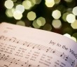 Stock photo of a hymnal open to "Joy to the World"