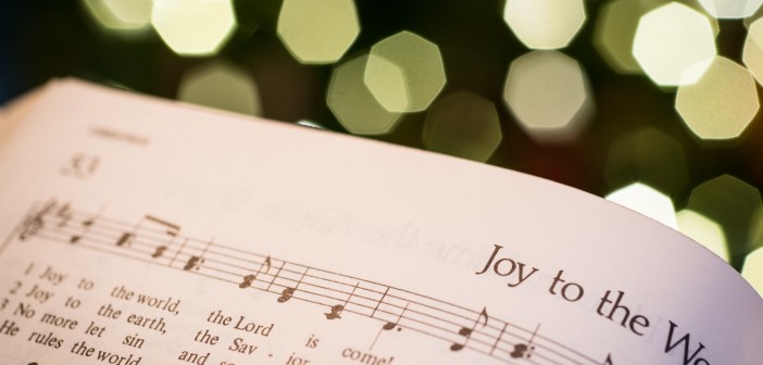 Stock photo of a hymnal open to "Joy to the World"