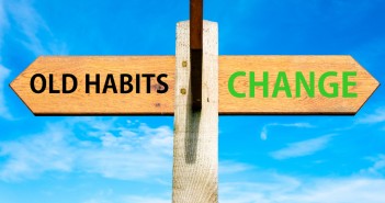 Stock photo of sign post with "OLD HABITS" in one direction and "CHANGE" in the other