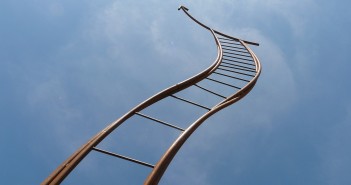 Stock photo of a bendy ladder going towards the sky