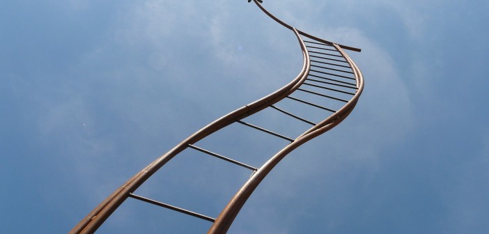 Stock photo of a bendy ladder going towards the sky
