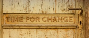 Stock photo of a door with the words "TIME FOR CHANGE" carved into it
