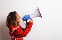 Photo of a woman shouting into a megaphone