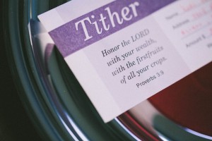 Photo of a tithing card in an offering plate