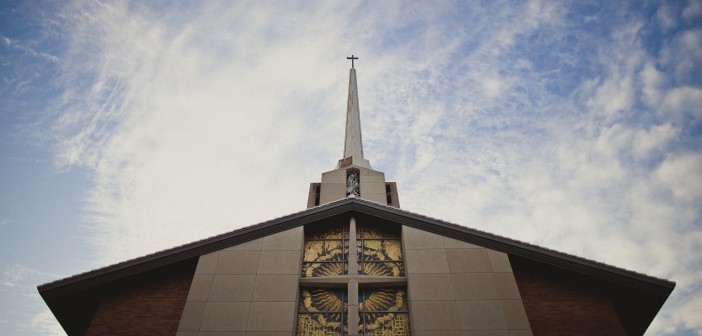 Photo of a church building against the sky.