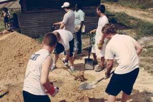 Stock photo of a group of people working on a community farm
