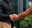 People greeting each other with a handshake