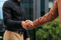 People greeting each other with a handshake