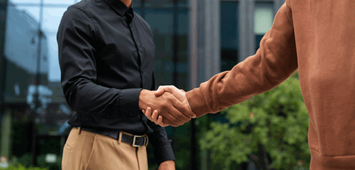 People greeting each other with a handshake