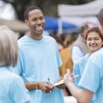 Church members with clipboards at an event