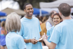 Church members with clipboards at an event