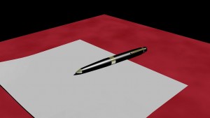 Image of pen resting on paper