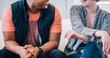 Photo of two people engaged in conversation