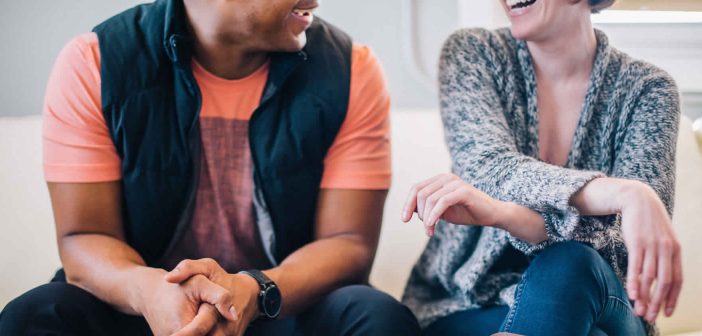 Photo of two people engaged in conversation