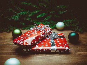 Stock photo of two wrapped Christmas presents under a tree