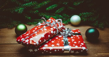 Stock photo of two wrapped Christmas presents under a tree