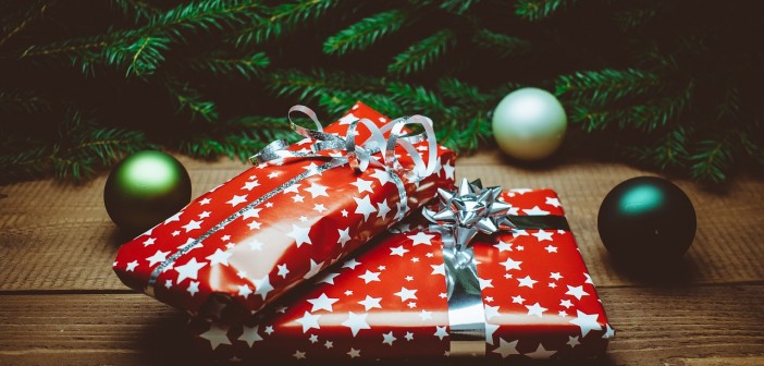 Stock photo of two wrapped Christmas presents under a tree