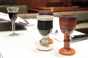Photo of several cups to be used in a communion service