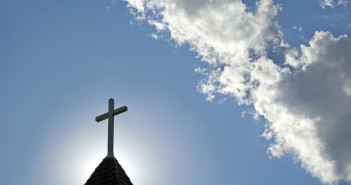 Photo of church steeple against a blue sky