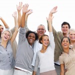 Photo of a group of friendly, smiling people waving hello