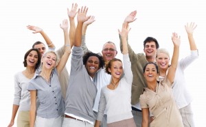 Photo of a group of friendly, smiling people waving hello
