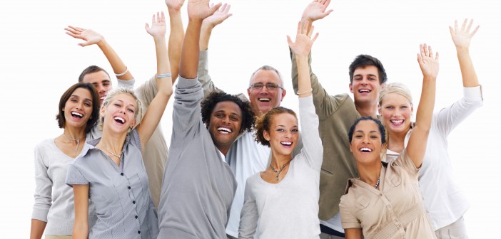Photo of a group of friendly, smiling people waving hello