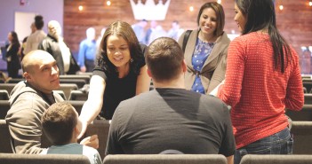 Stock photo of a group of people of mixed genders and races and ages in fellowship with one another