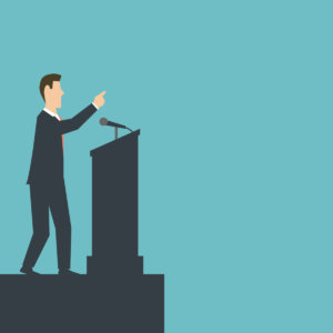Cartoon image of a white man in a business suit standing at a podium and giving an impassioned speech