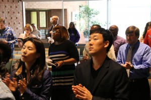 Photo of a diverse congregation singing during a worship service