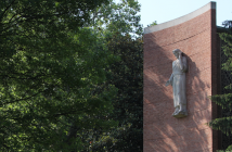 Image of Jesus statue, a chapel, and trees