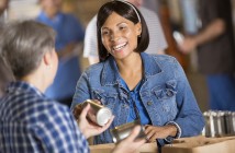 Why Community Engagement Matters Photo of women bagging groceries at a food bank