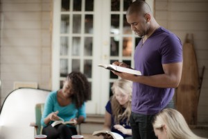 Photo of three people in a church group