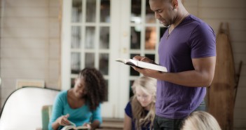 Photo of three people in a church group