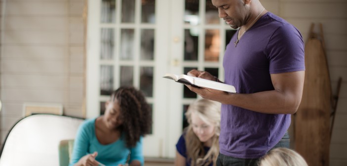 Photo of three people in a church group