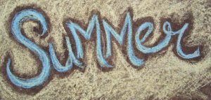 Sidewalk chalk drawing of the word SUMMER