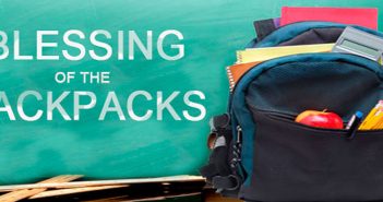 Photo of child's backpack with school supplies and the words Blessing of the Backpacks