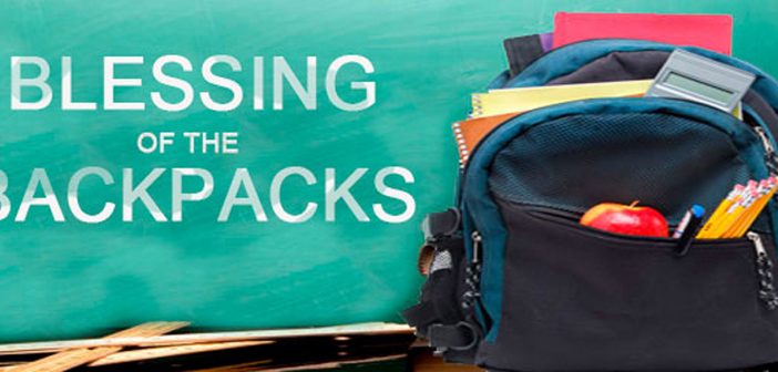 Photo of child's backpack with school supplies and the words Blessing of the Backpacks