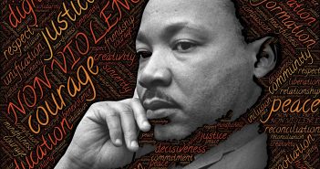 picture of Dr. Martin Luther King, Jr. in front of a word cloud