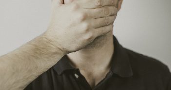 Male covering his mouth with his hand. 9 Things Preachers Should Never Say