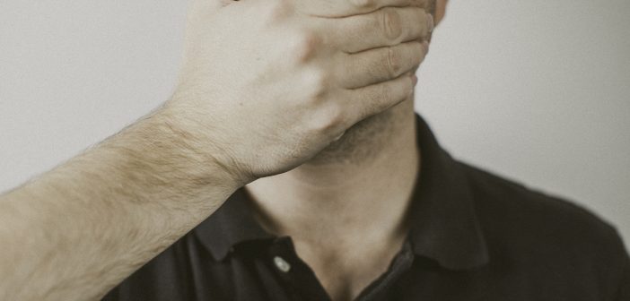 Male covering his mouth with his hand. 9 Things Preachers Should Never Say