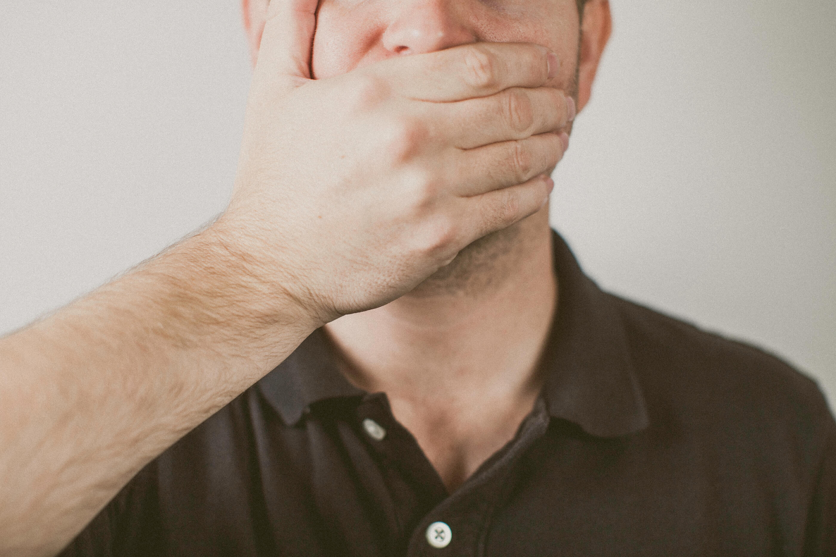 Male covering his mouth with his hand. 9 Things Preachers Should Never Say