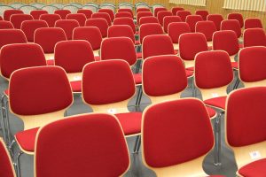 A bunch of red chairs set up in an overflow room on Easter Sunday